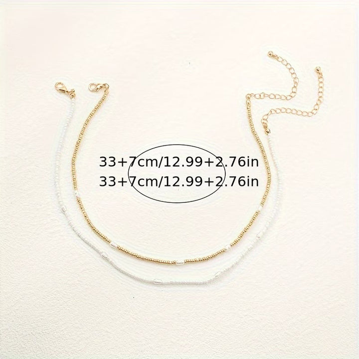 Necklace set draped over a stand to show all layers together