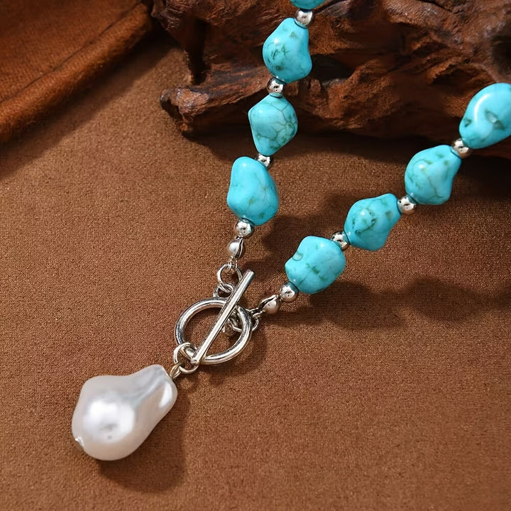 Model wearing the turquoise and pearl necklace