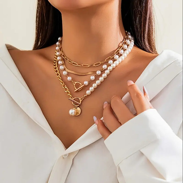Pearl necklace set draped over a wooden jewellery box
