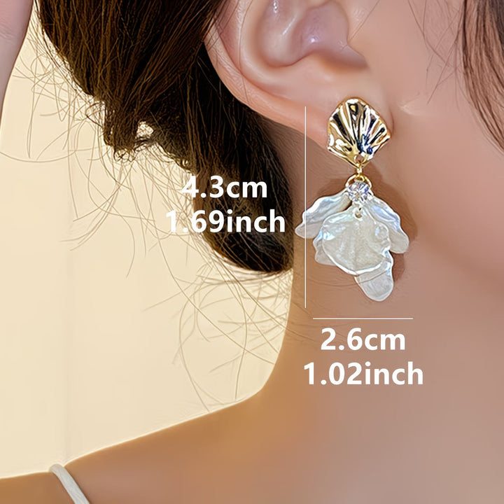 Model wearing the frosted petal pearl earrings