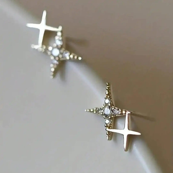 Main shot of the shimmering star drop earrings