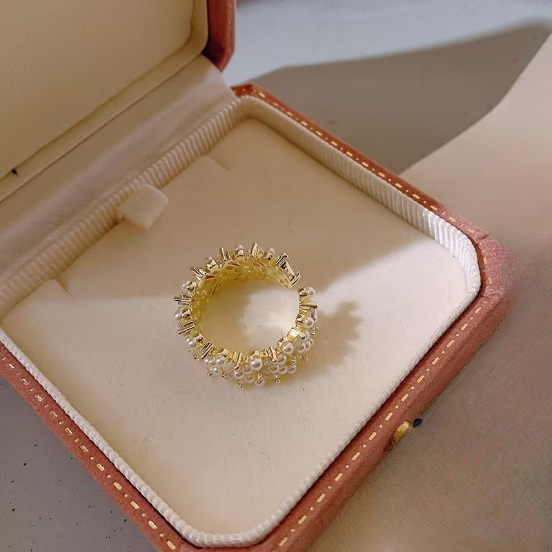 Model wearing the pearl leaf ring on one finger