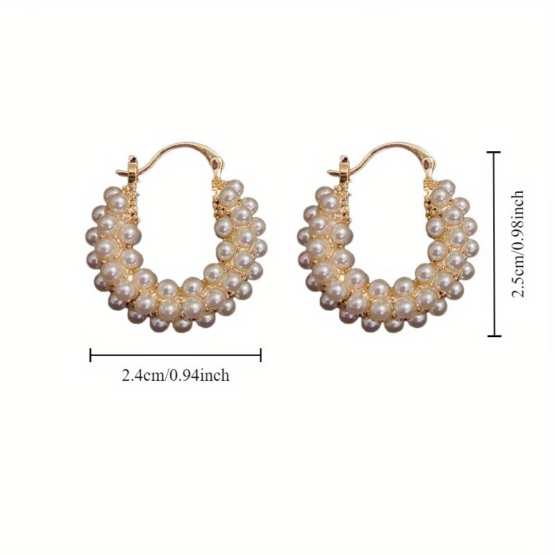 Pearl hoop earrings shown from a front-facing angle
