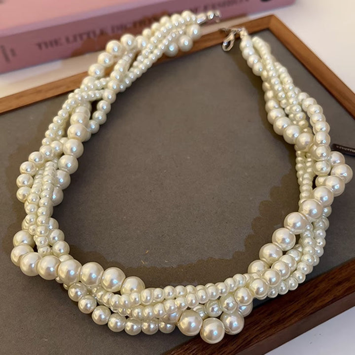 Statement pearl necklace styled on a mannequin neck form