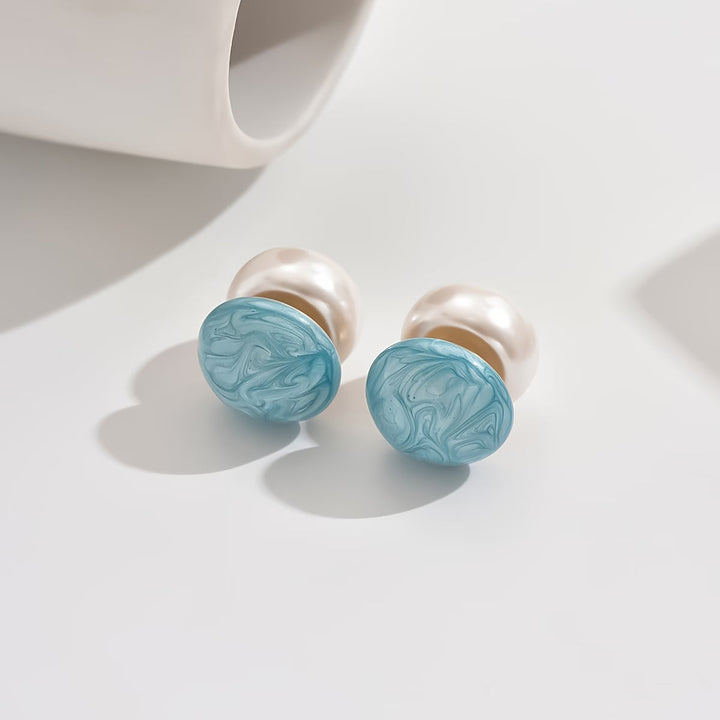 Turquoise side of the earrings shown in detail