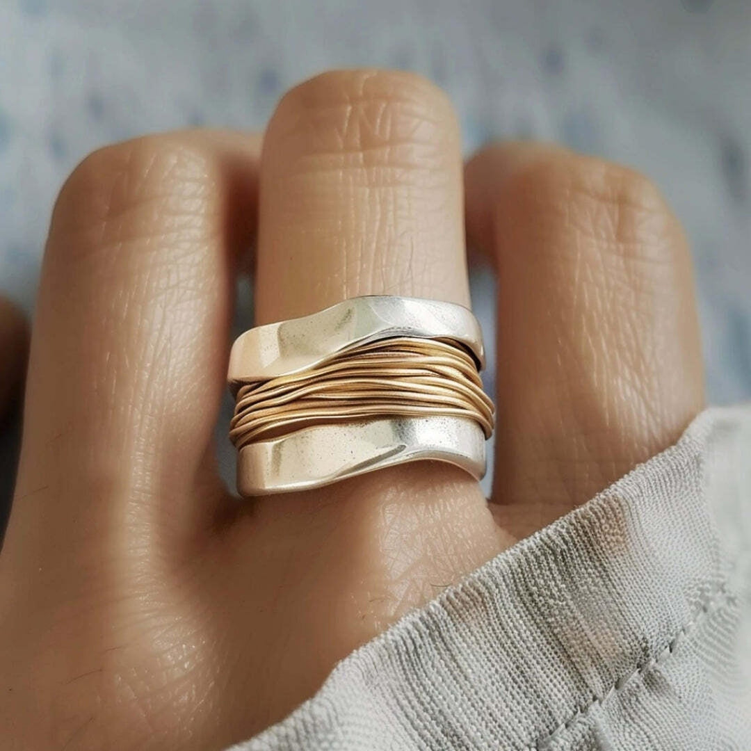 Main shot of the silver and gold threads ring