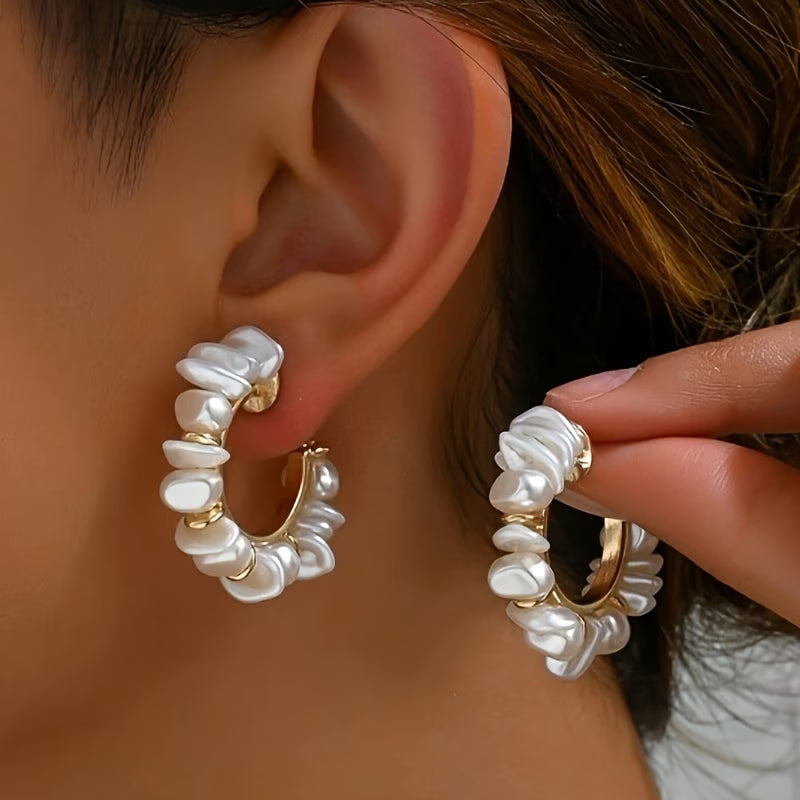 Chunky pearl earrings shown on a plain background
