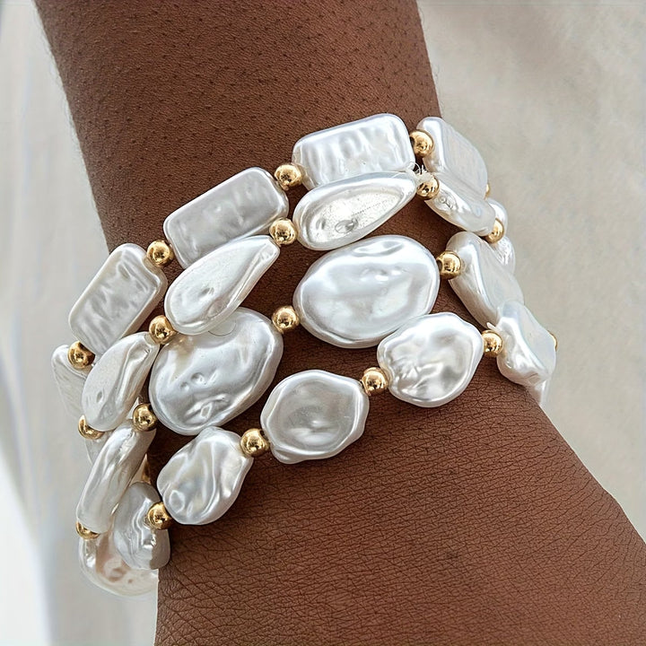 Pearl statement bracelet set of four laid flat together