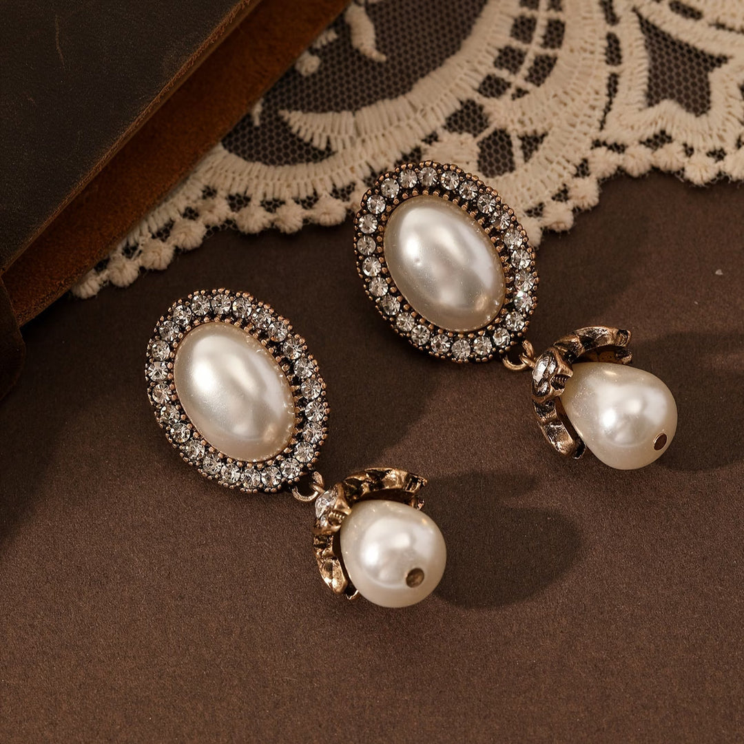 Model wearing the vintage pearl frame earrings