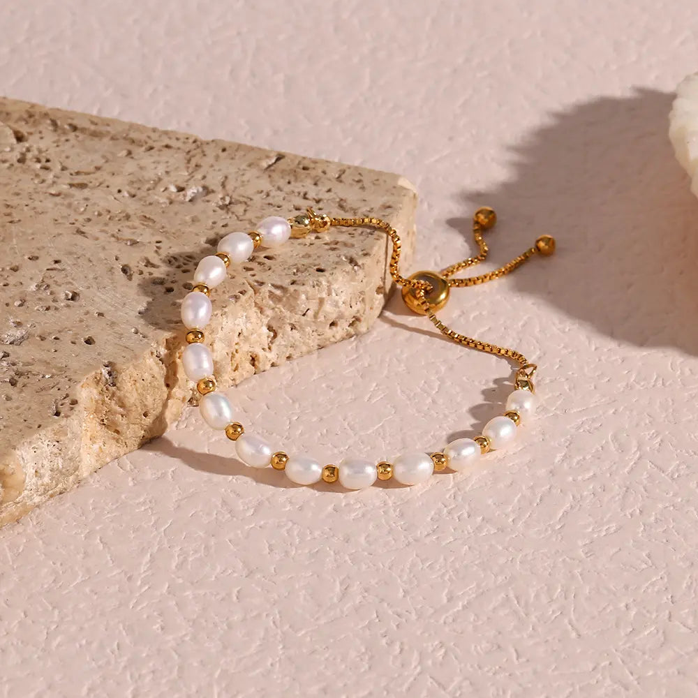Pearl and gold-tone bracelet displayed inside its gift box