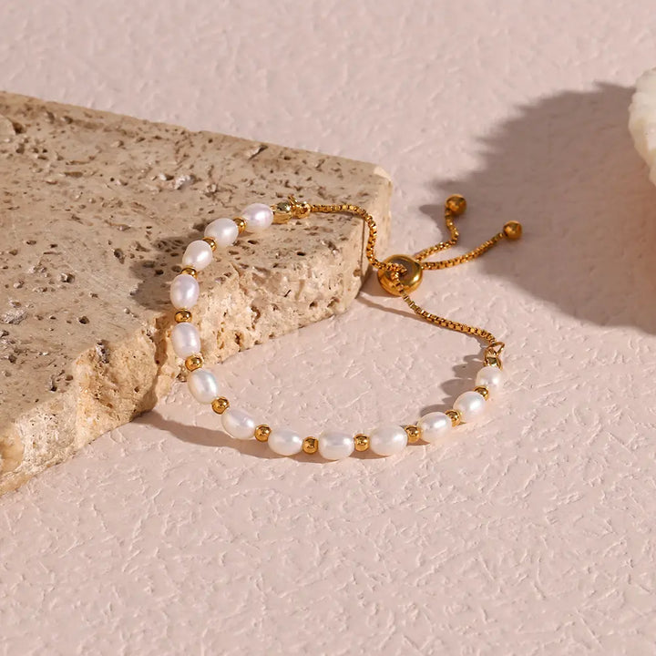 Pearl and gold-tone bracelet displayed inside its gift box
