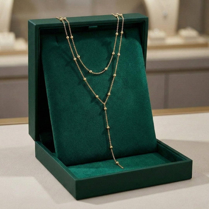 Necklace worn on a model's neckline