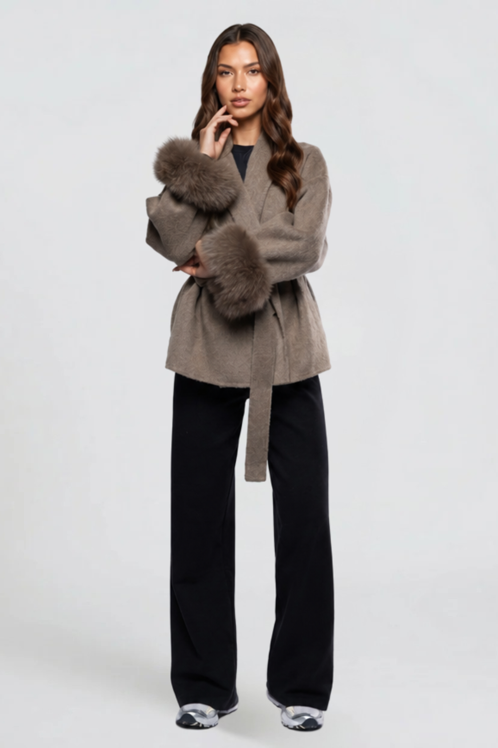 Close view of taupe wool wrap coat showing oversized faux fur cuff detail