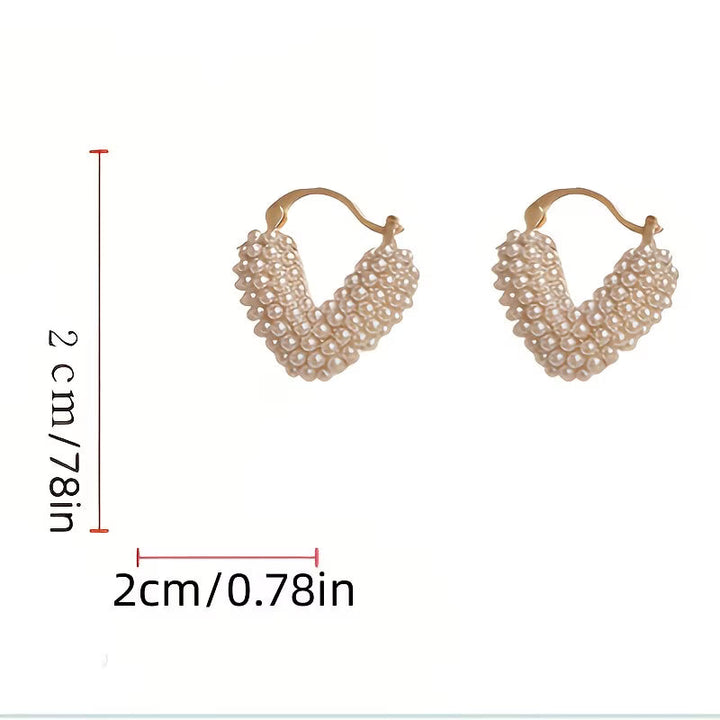 Model wearing the V-shaped everyday pearl earrings