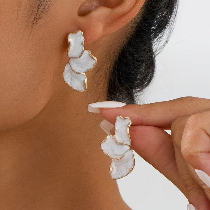 Pearl flower petal earrings displayed on a white background
