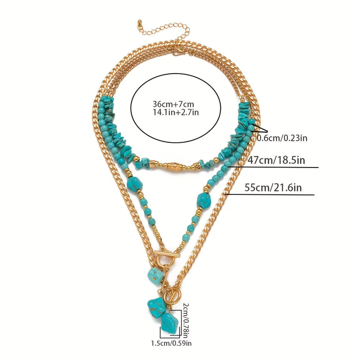 Statement turquoise necklace styled with a coordinating outfit