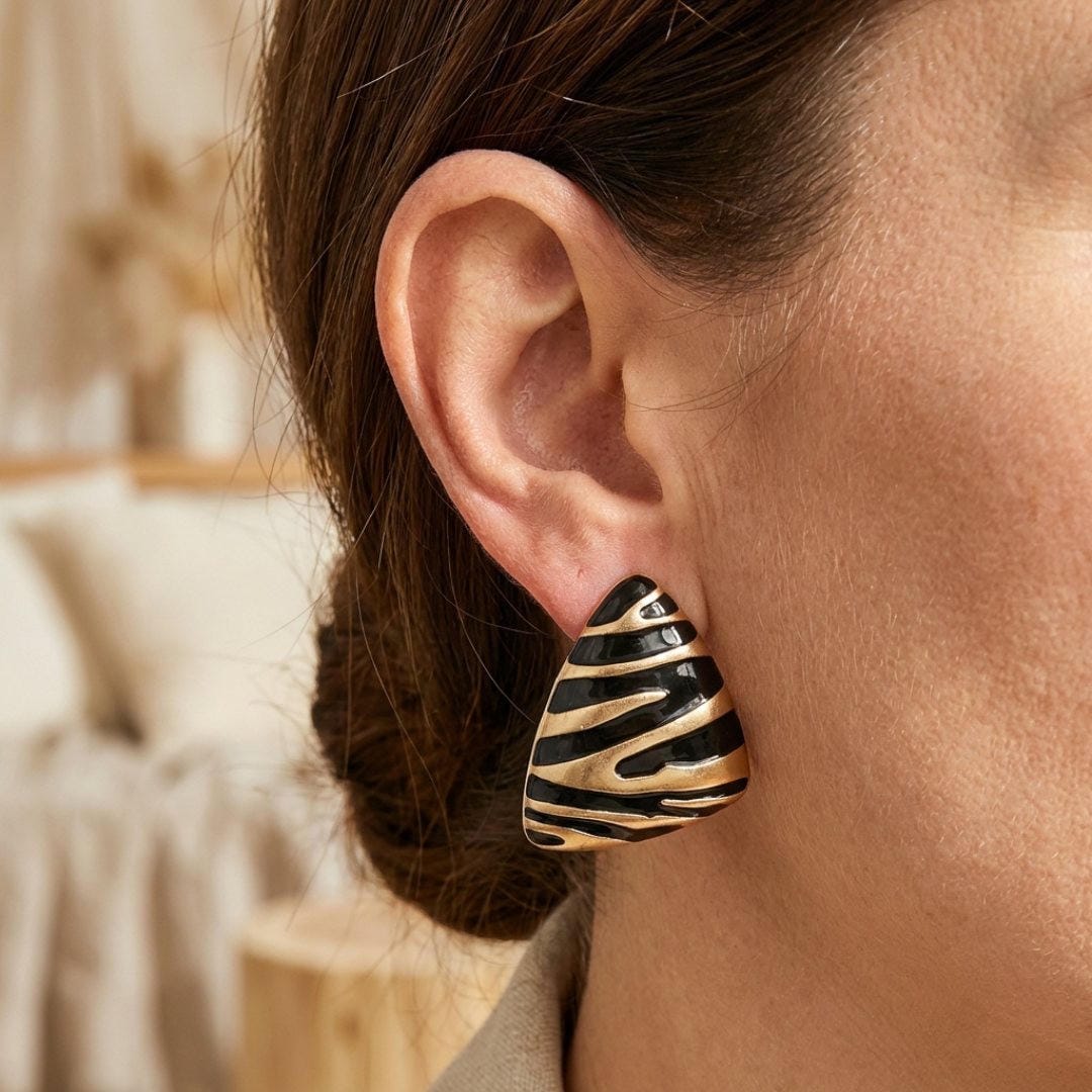 Main shot of the triangular zebra print earrings