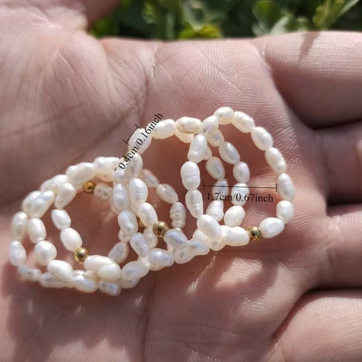Pearl ring worn on a finger to show true scale