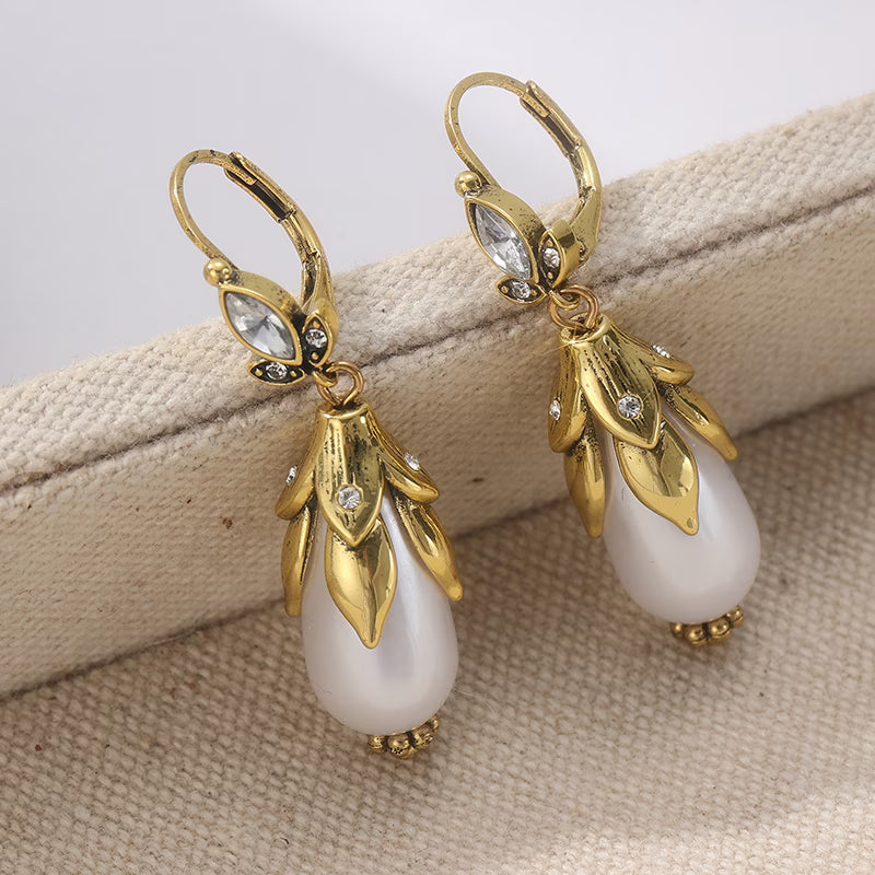 Pair of botanical earrings shown side by side