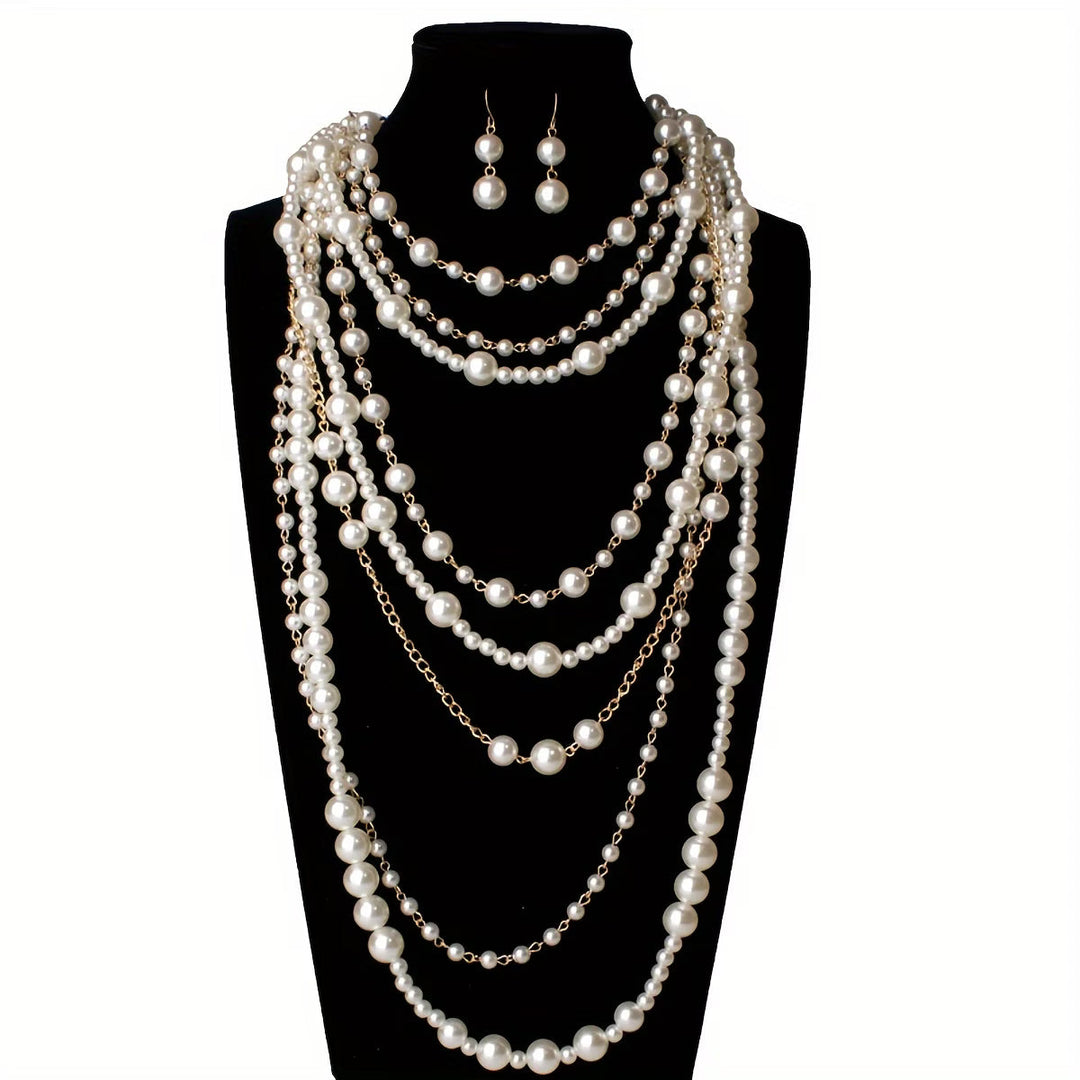 Boho multi-layered pearl set displayed against a textured backdrop