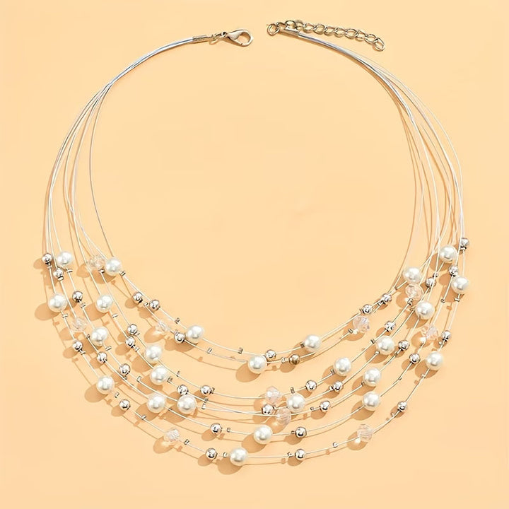 Necklace piece laid flat showing all layers