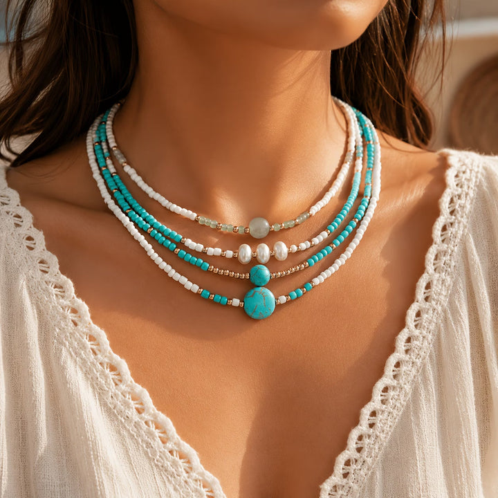 Pearl and turquoise beaded bracelet set displayed as a stack