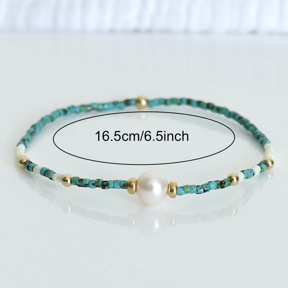 Turquoise pearl bracelet photographed at an angle showing bead texture