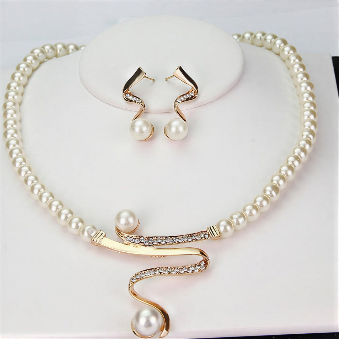 Pearl jewelry set with wave-shaped necklace and matching earrings