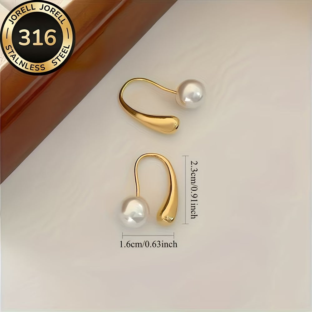 Minimalist arc pearl earrings displayed on a plain background