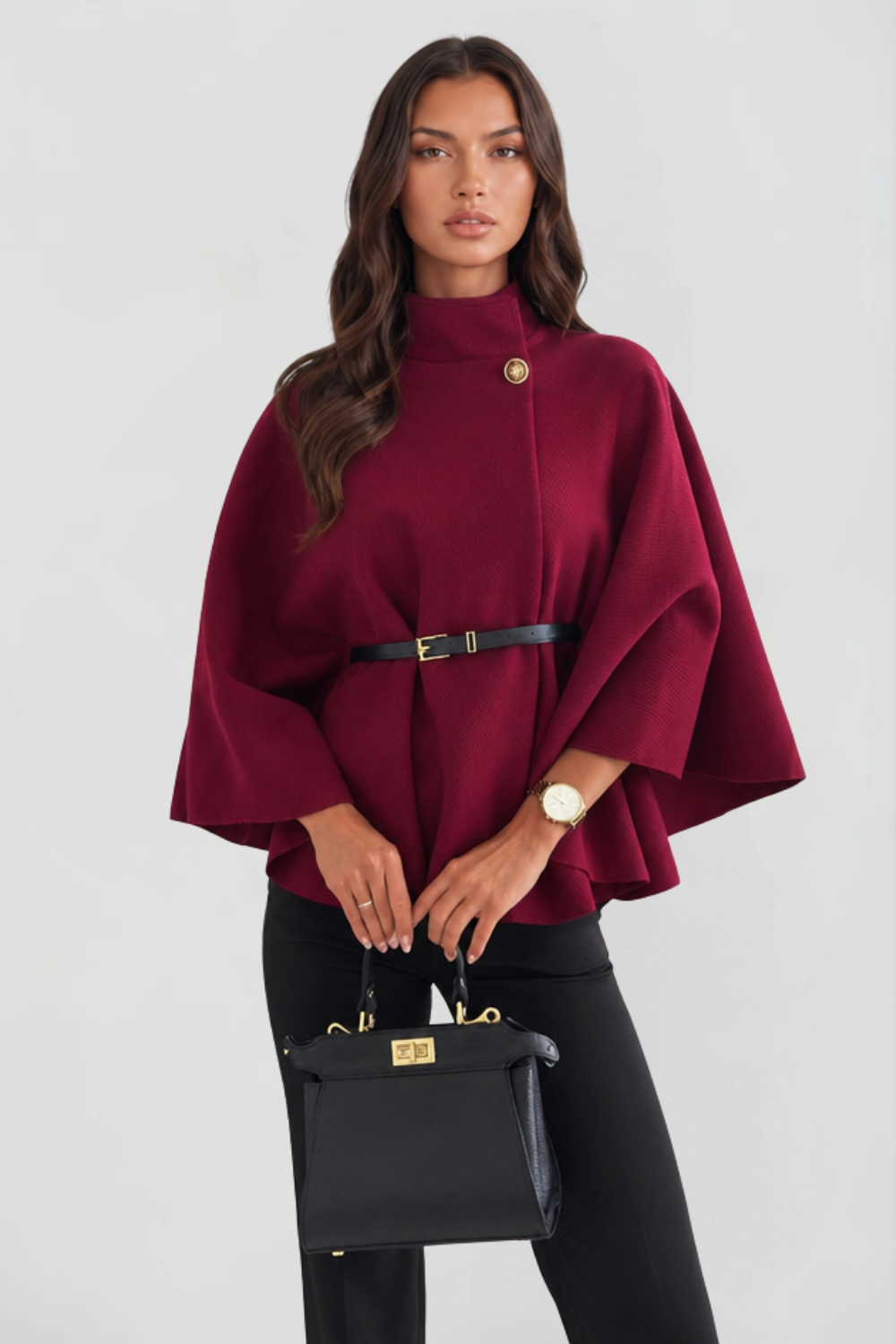 Wine red wool cape with gold button collar and belted waist, close front view