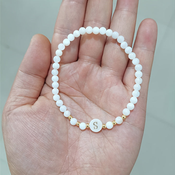 Bracelet laid flat showing the full pearl strand