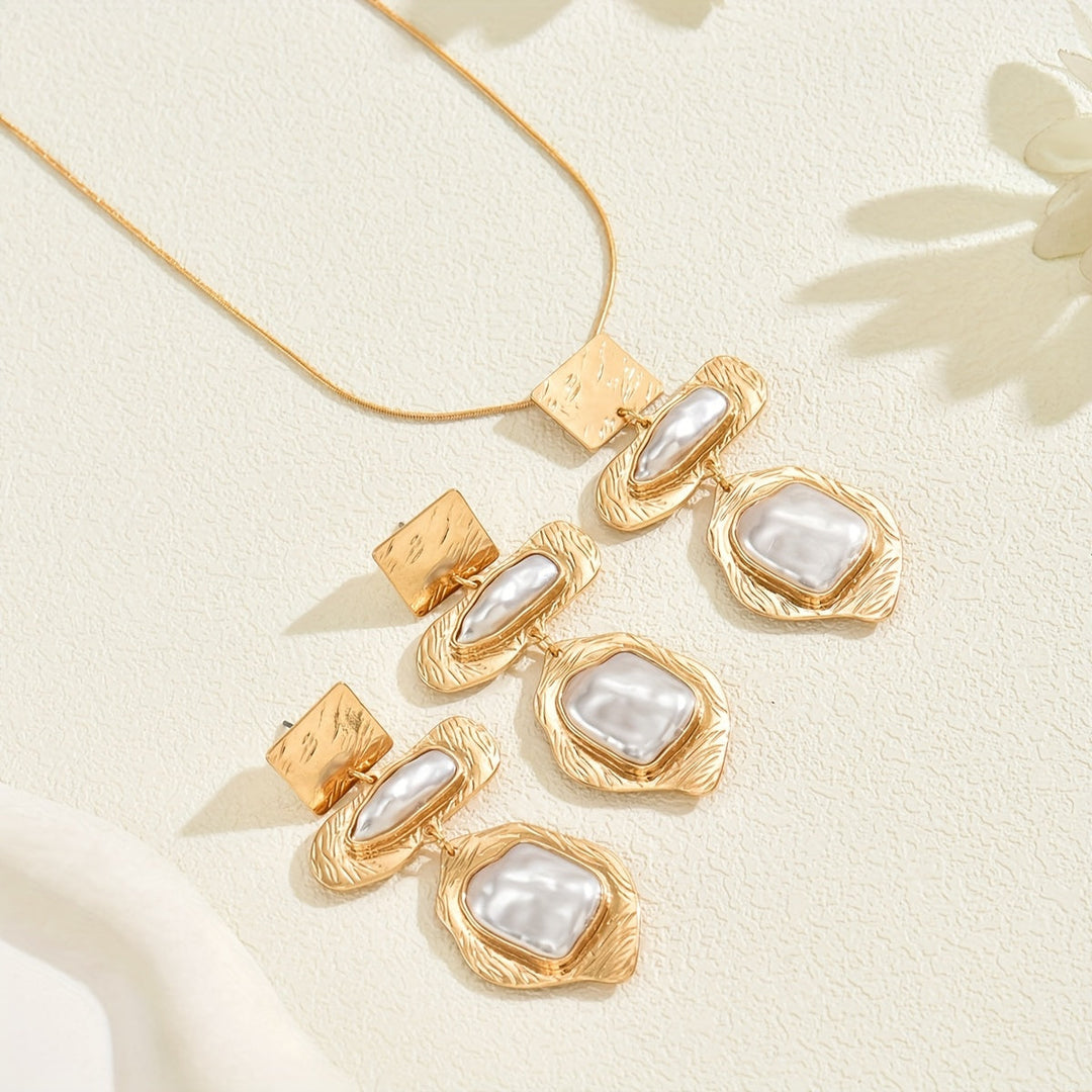 Elegant pearl mosaic jewellery set laid flat on a white background