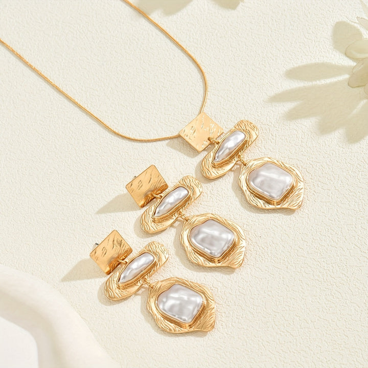 Elegant pearl mosaic jewellery set laid flat on a white background