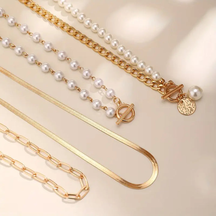 Layered pearl necklace set styled with a plain white blouse