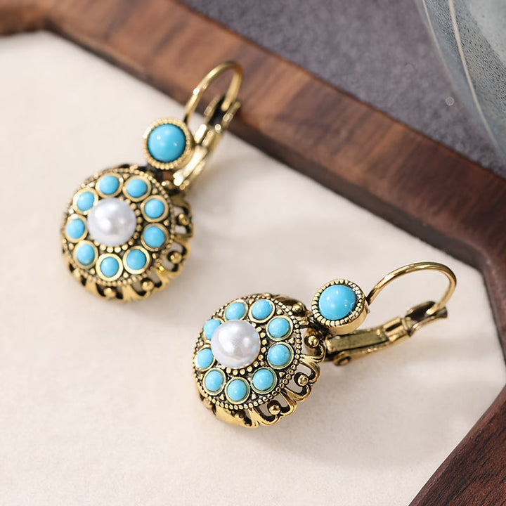 Main shot of the pearl bloom and turquoise drop earrings