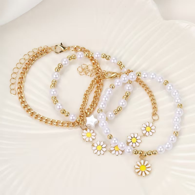 Close-up of a daisy charm among the pearl beads