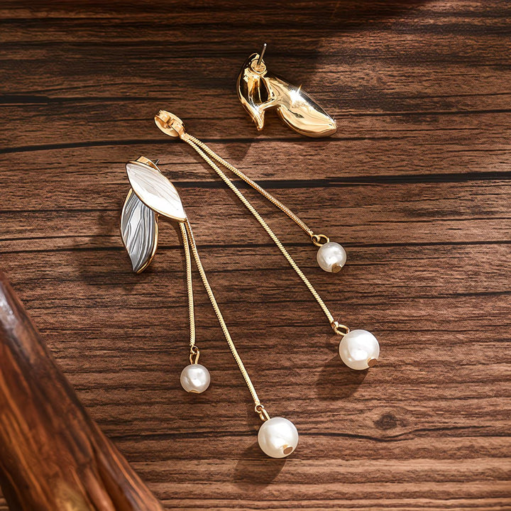 Model wearing the long pearl leaf earrings styled with hair back