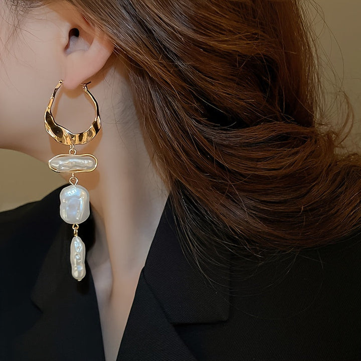 Angled close-up of the pearl and hoop craftsmanship