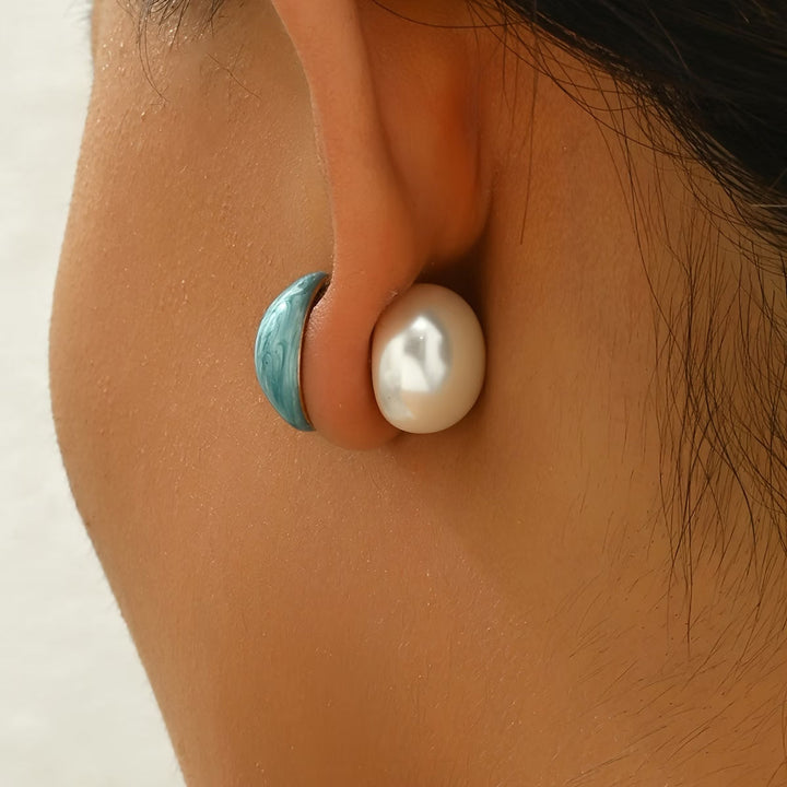 Pearl side of the earrings shown in detail