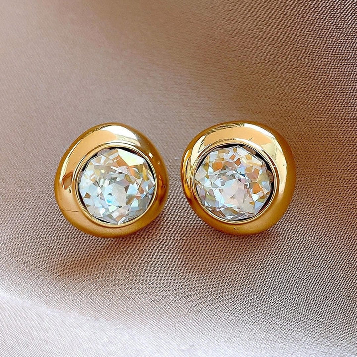 Main shot of the timeless gold round zirconia earrings