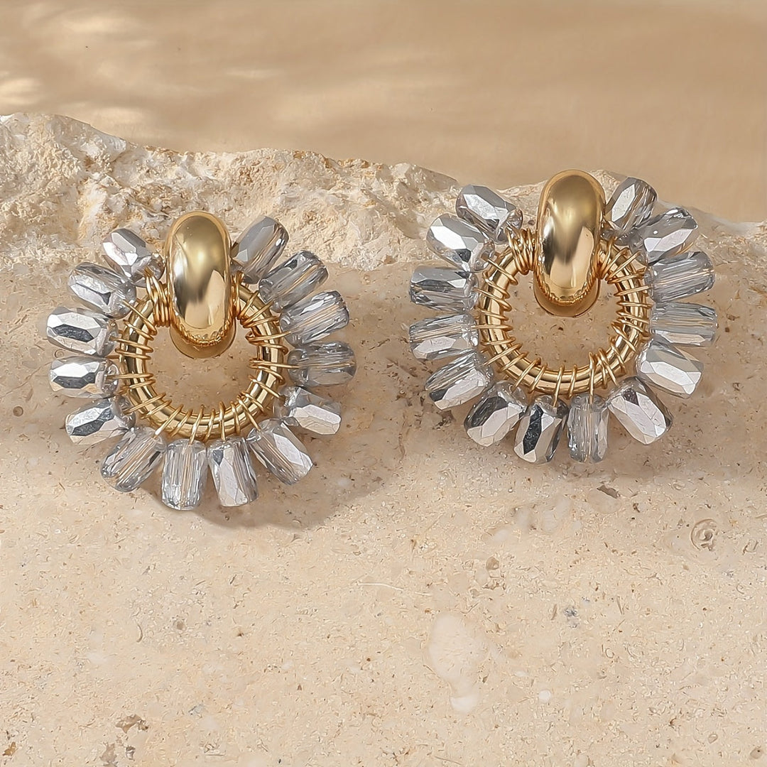 Elegant pearl beaded fan earrings shown on a white background