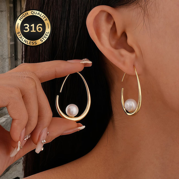 Close-up of pearls set along the crescent hoop earring edge