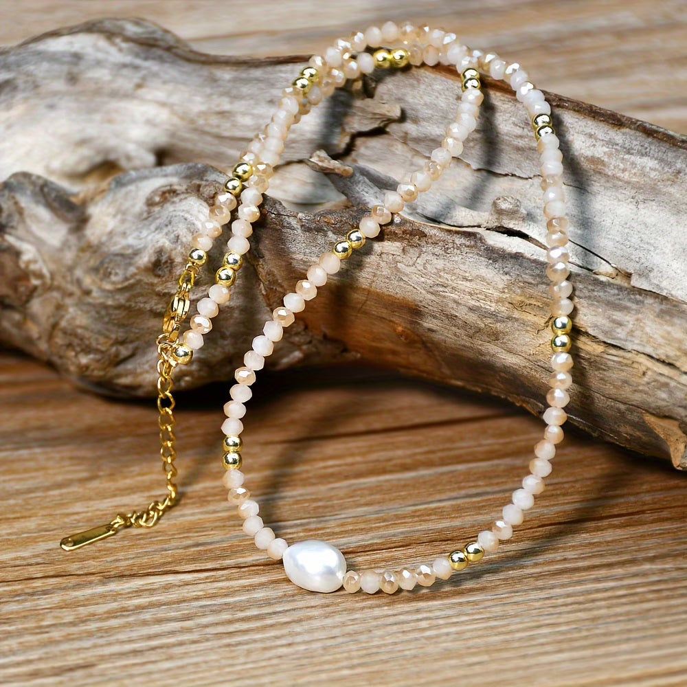 Model wearing the minimal pearl necklace at the collarbone