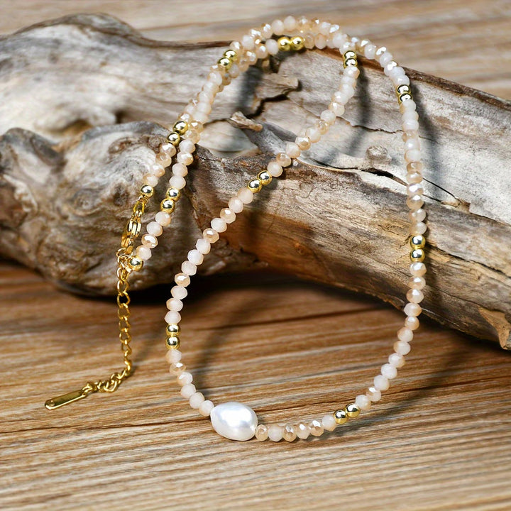Model wearing the minimal pearl necklace at the collarbone