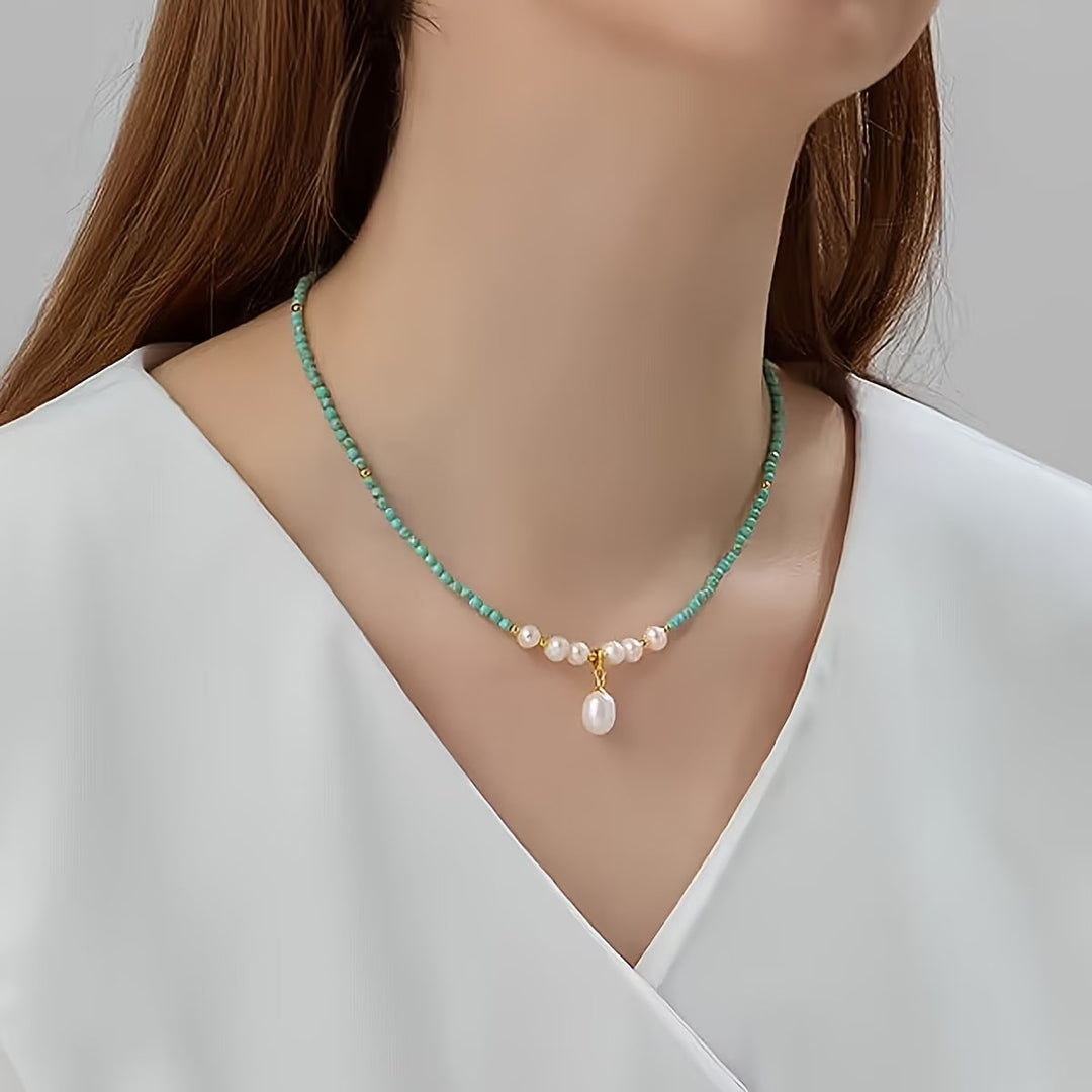 Necklace styled flat with turquoise and pearl earrings