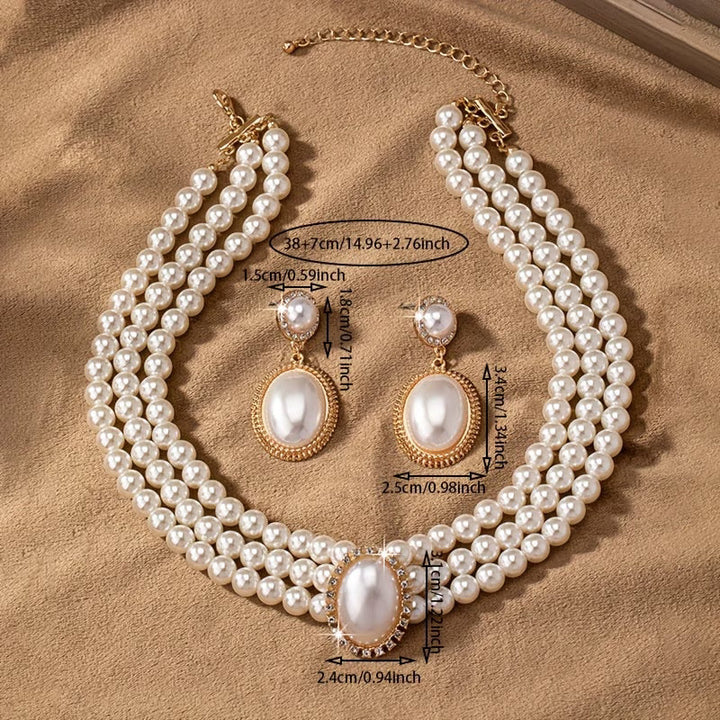 Pearl jewelry set displayed together on a white background