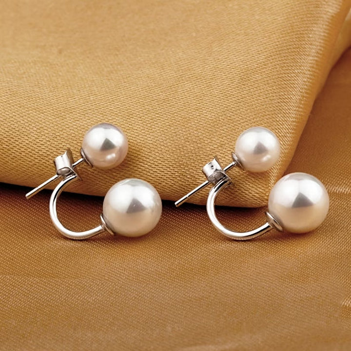 Close-up of the two-tier pearl earring design