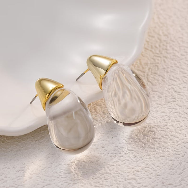 Close-up of the polished teardrop shape and pearl detail