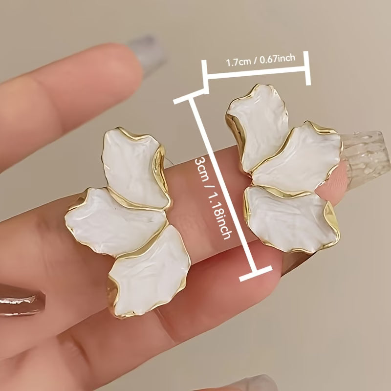 Model wearing the pearl flower petal earrings