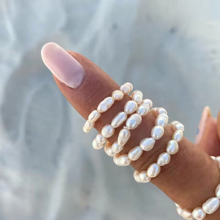 Elegant pearl statement ring shown on a plain white background